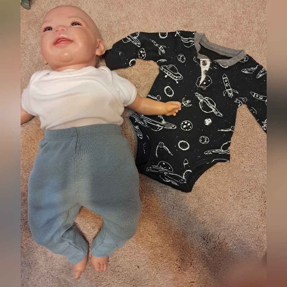 Reborn doll, 18", open eyes, painted hair, weighted 3-4 lbs, cloth body 3/4 limb